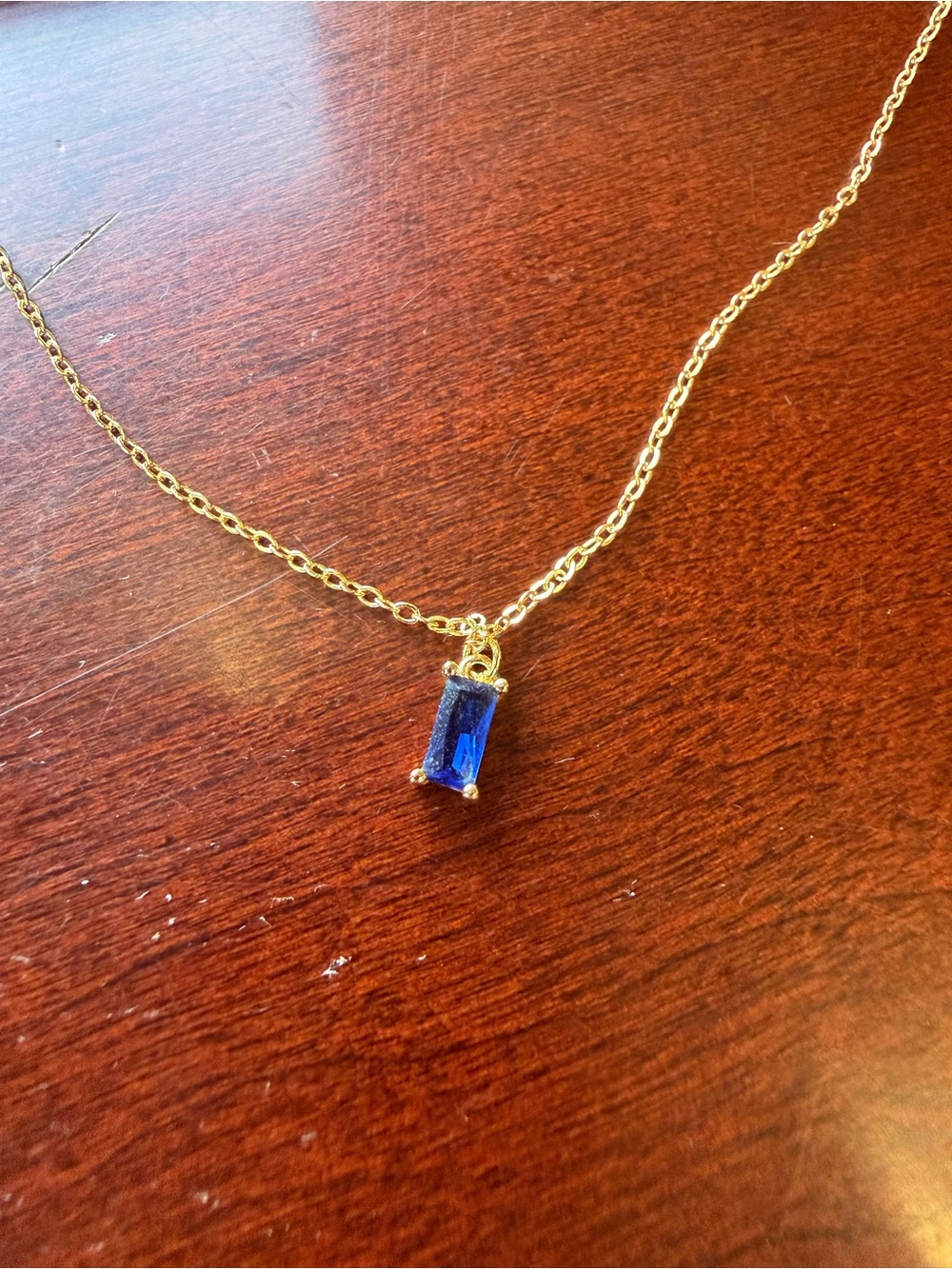 Llume sapphire pendant on gold vermiel chain